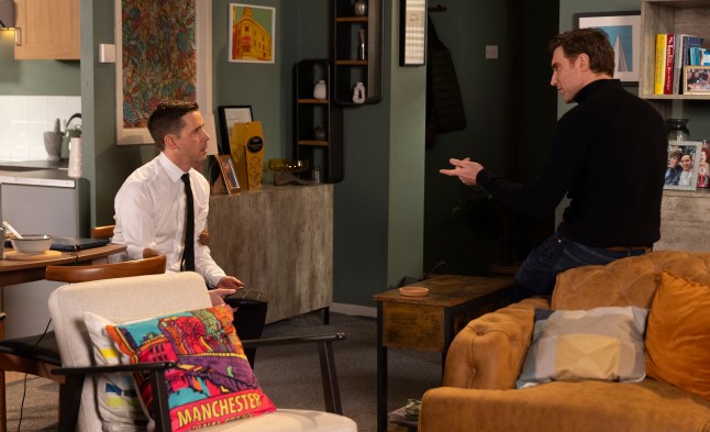 Todd Grimshaw arguing with Theo Silverton in the flat in Coronation Street.
