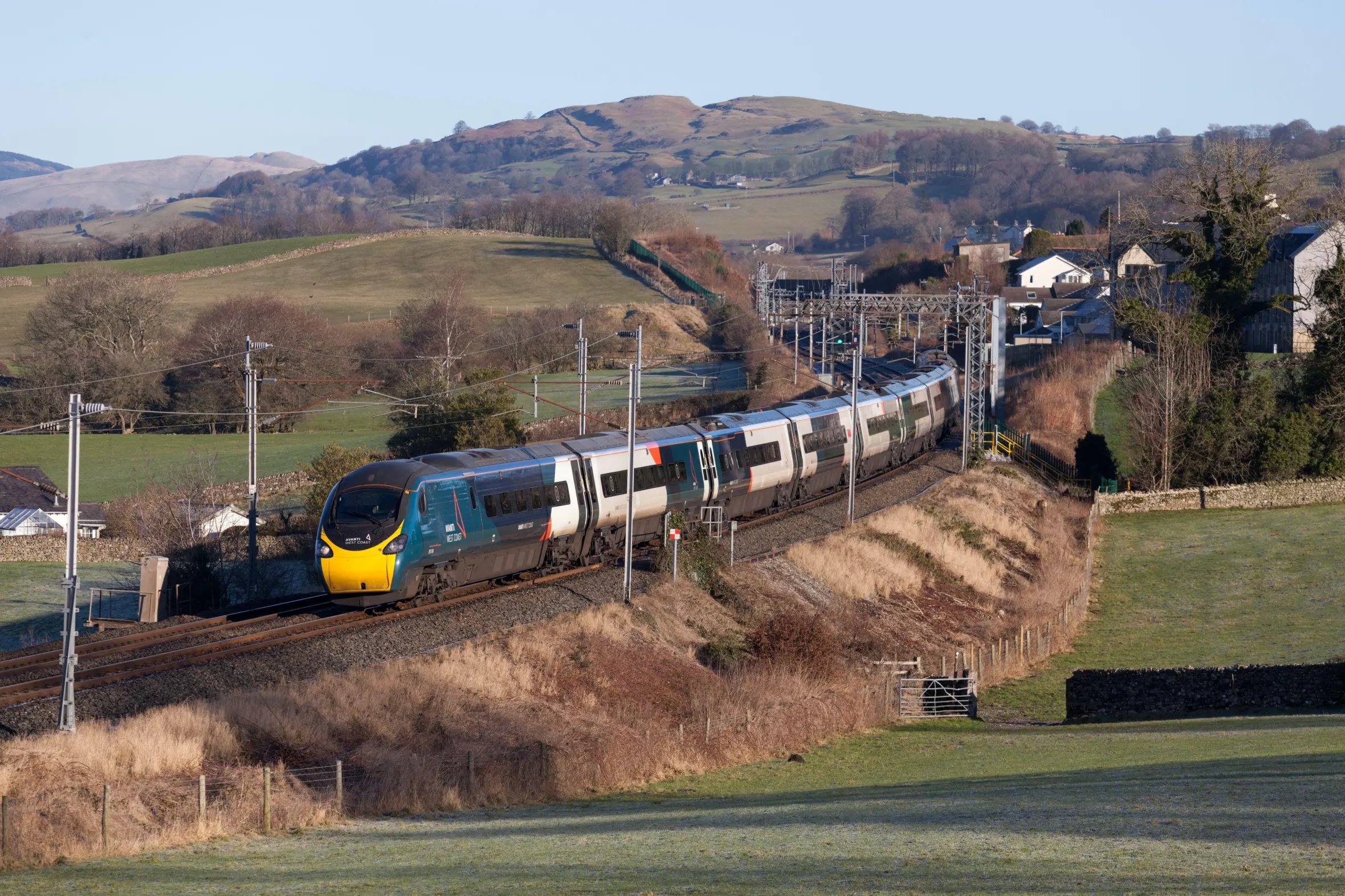 Avanti West Coast Alstom Class 390 Pendolino tilting train passing Natland, Cumbria, on a clear sunny morning.