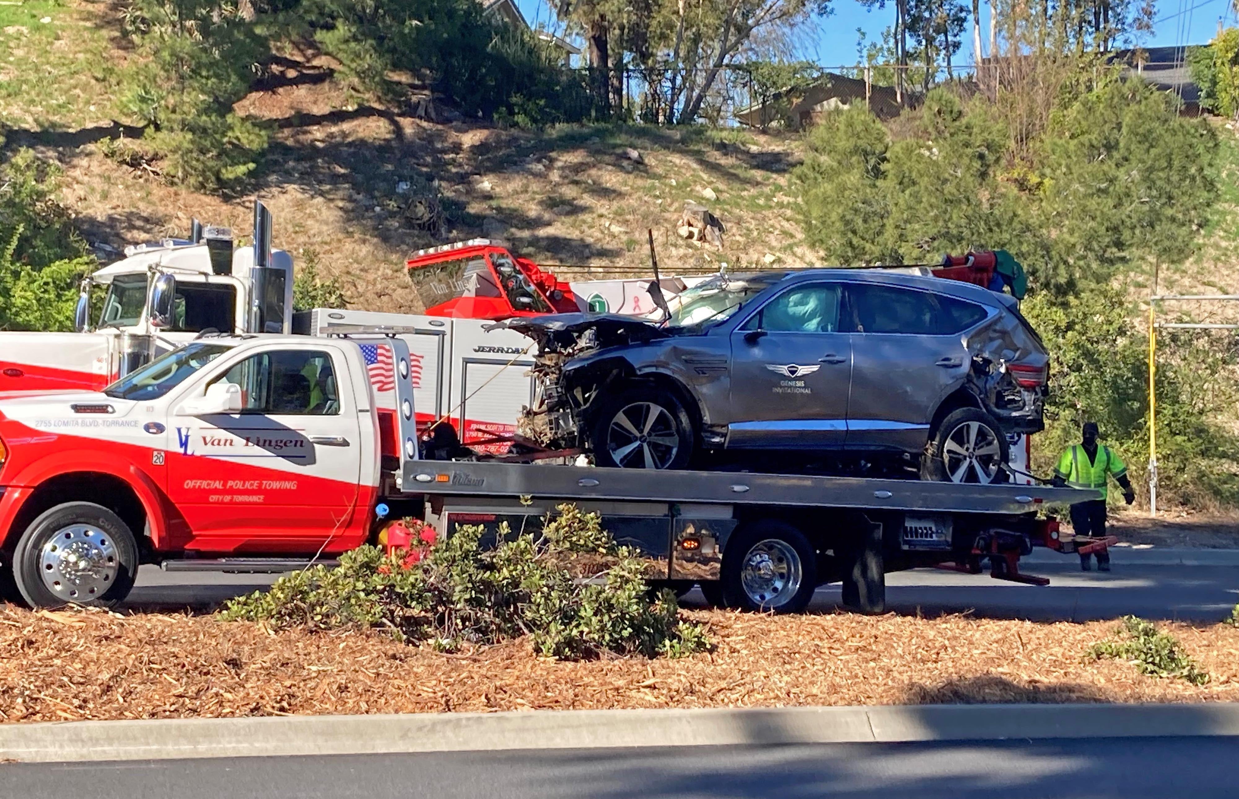 The vehicle driven by Tiger Woods on the back of a truck in Los Angeles following his crash on February 23, 2021