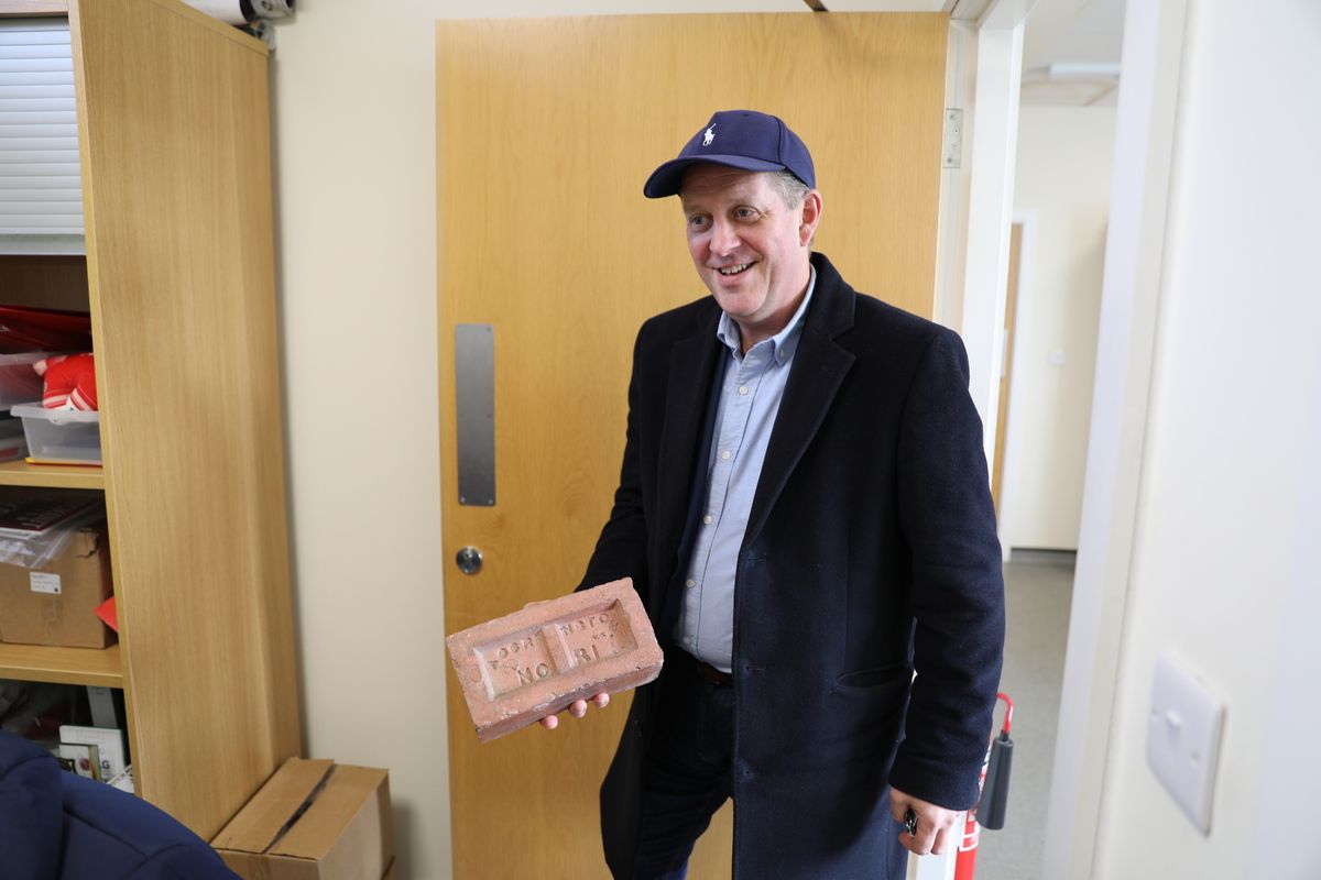 Murray Dawson, with an Accrington brick