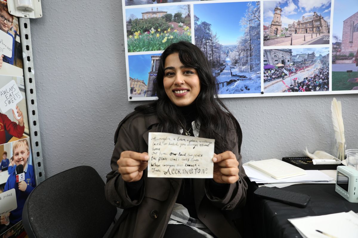 Zara holding up a bit of paper 