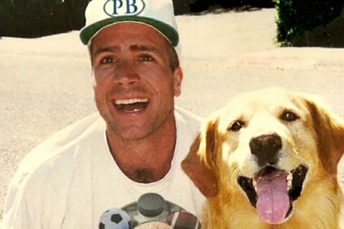 Close up of Kevin DiCicco and his dog Buddy smiling