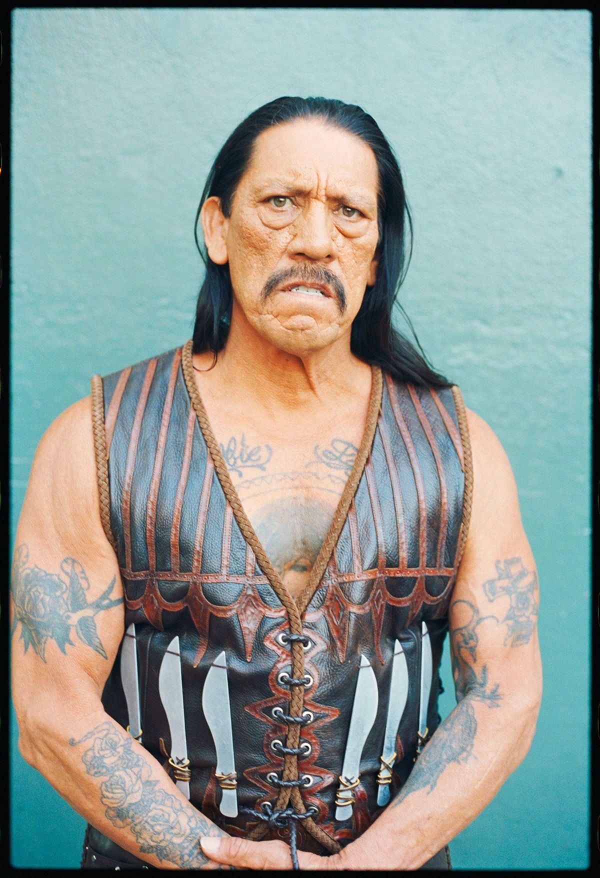 Danny Trejo poses for the Machete movie premiere in an alley behind the Orpheum Theatre Downtown Los Angeles 2010.