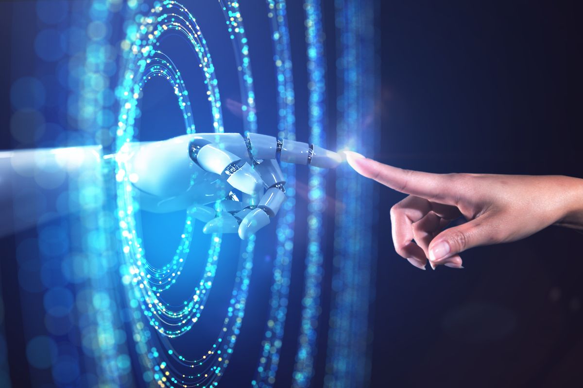 stock image  of a woman's hand accessing the digital world from the real world.