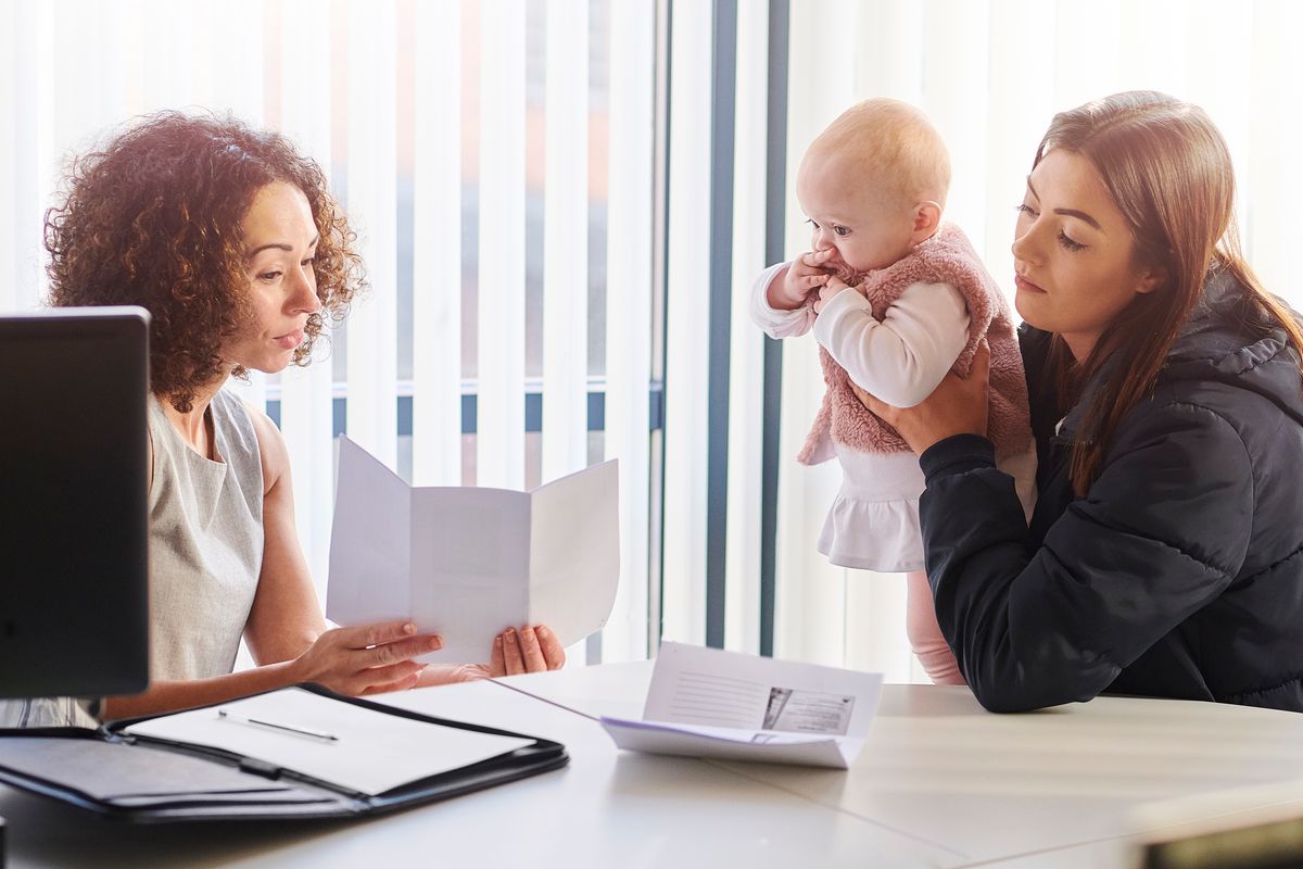 young mother with social services or housing officer