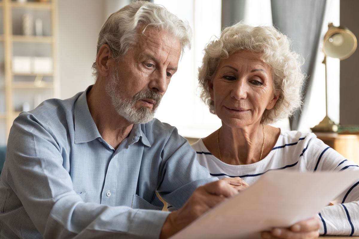 Couple reading bills