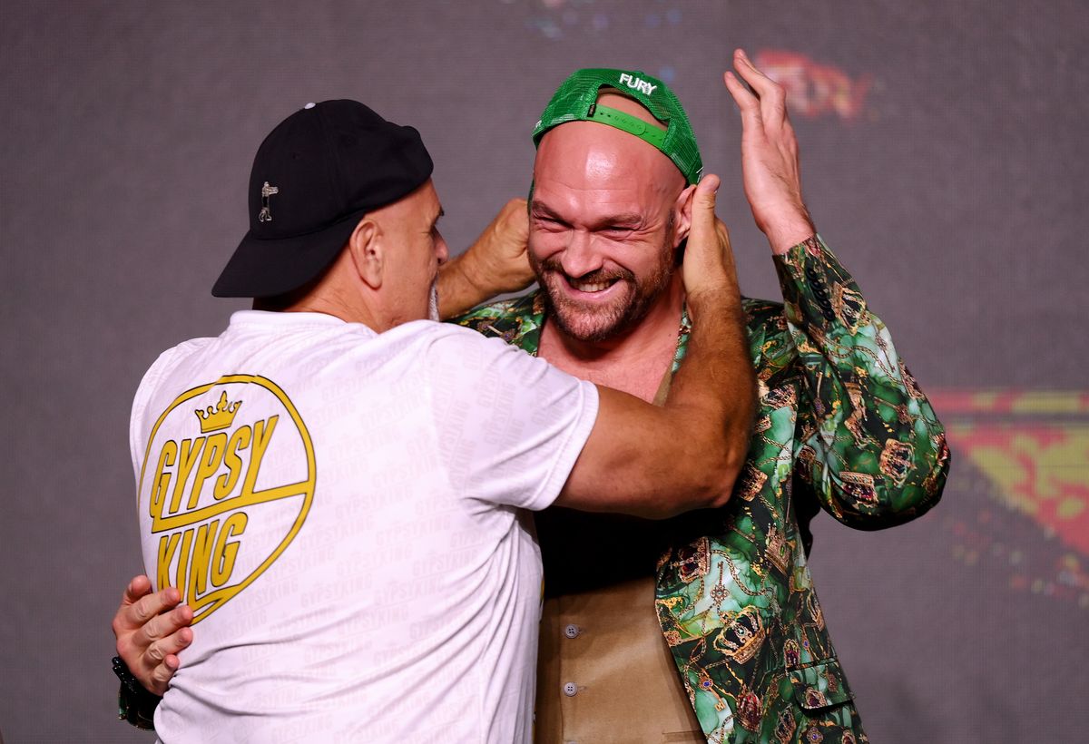 John Fury and Tyson Fury react during a press conference ahead of the Tyson Fury v Francis Ngannou boxing match at Boulevard Hall on October 26, 2023 in Riyadh, Saudi Arabia