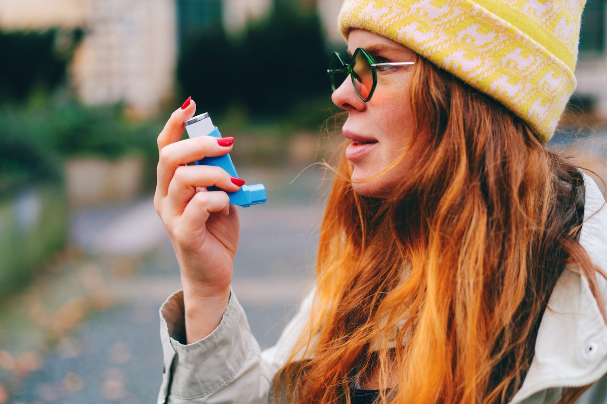 A woman with an asthma inhaler