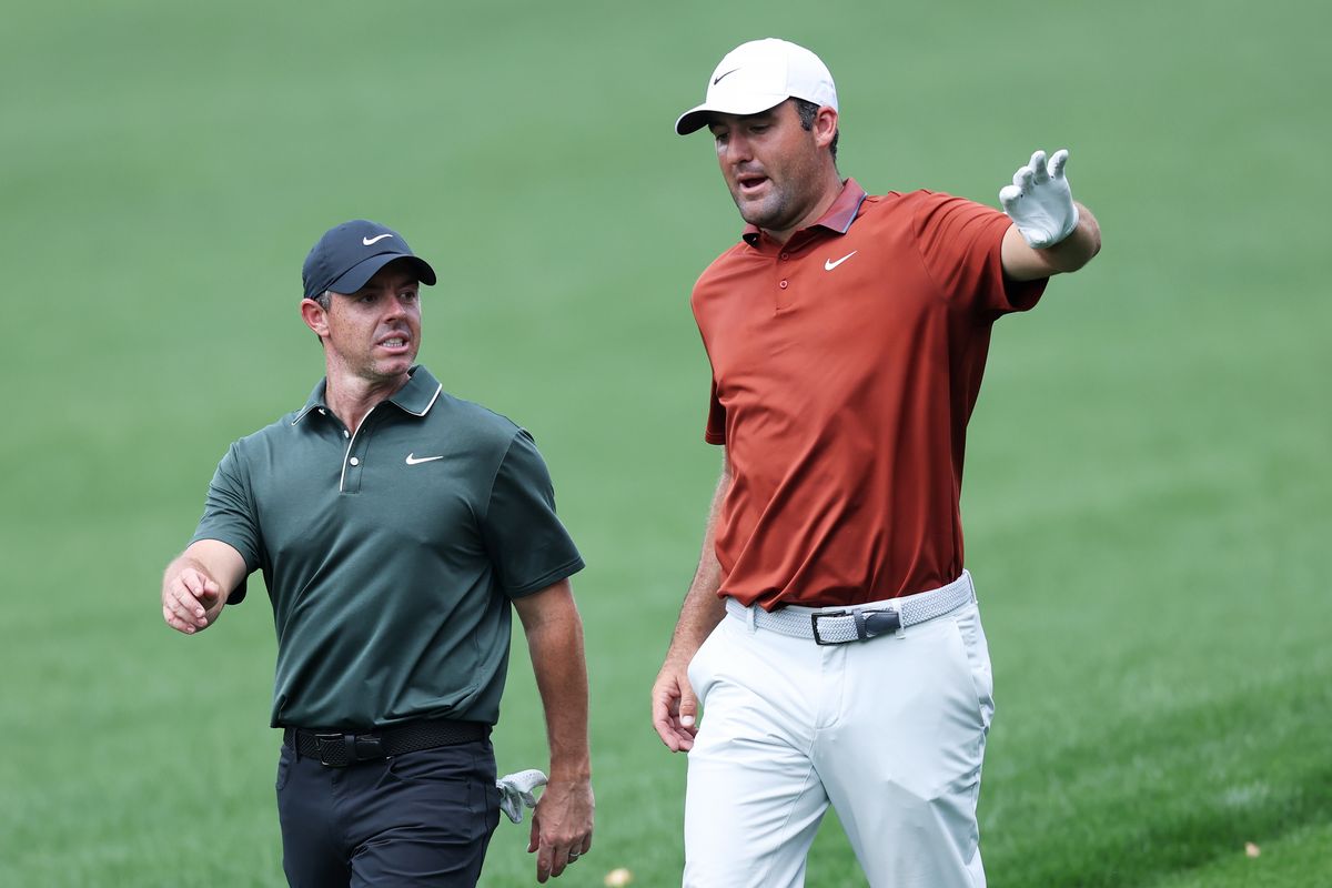 Rory McIlroy of Northern Ireland and Scottie Scheffler of the United States talk as they walk the 7th fairway during the first round of the PGA Championship at Quail Hollow Country Club on May 15, 2025 in Charlotte, North Carolina. 