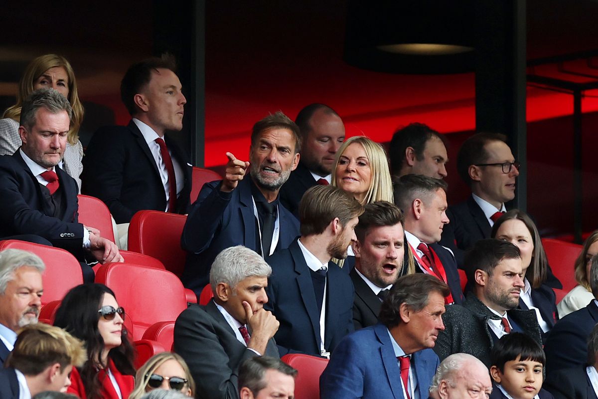 Former Liverpool Manager and current Head of Global Soccer for Red Bull GmbH Juergen Klopp speaks with Wife Ulla Sandrock during the Premier League match between Liverpool FC and Crystal Palace FC at Anfield on May 25, 2025 in Liverpool, England. 