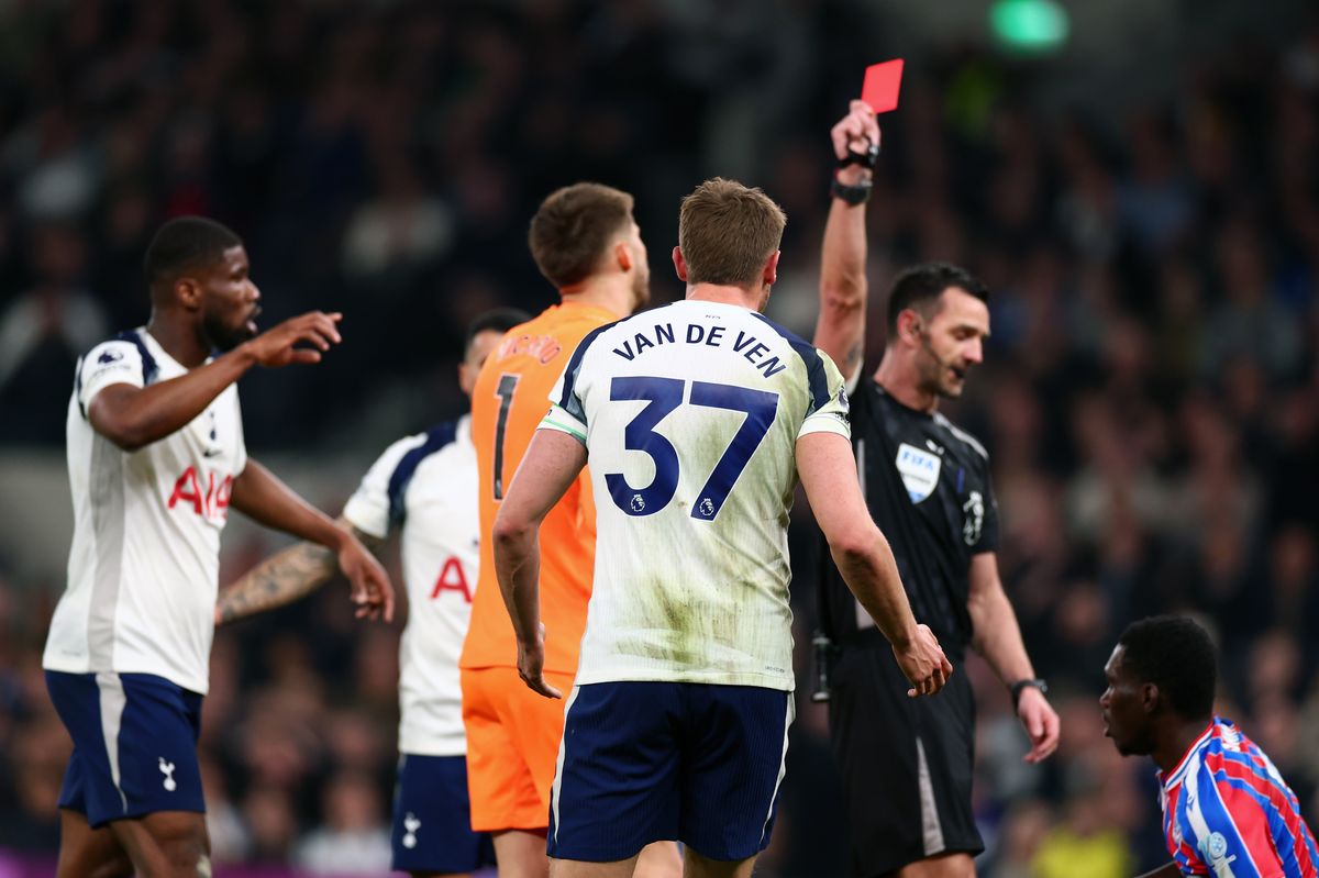 Micky van de Ven is shown a red card by referee Andy Madley during the Premier League match between Tottenham Hotspur and Crystal Palace