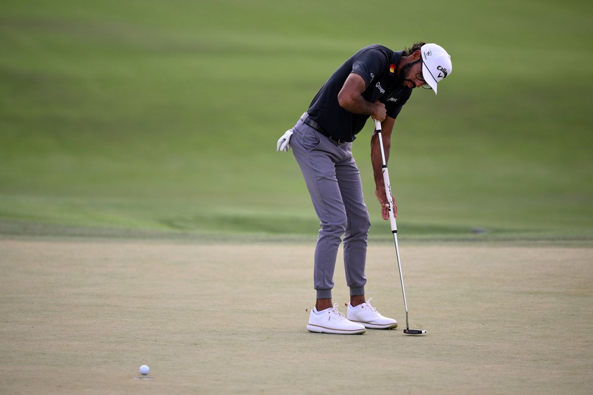 Akshay Bhatia hits a putt on the second green at Bay Hill