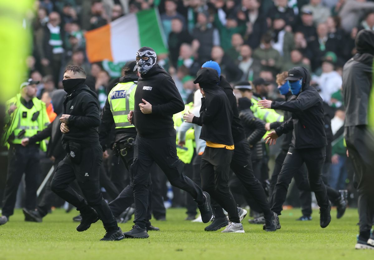 GLASGOW, SCOTLAND - MARCH 08: Rangers Ultras invade the pitch following the Scottish Gas Scottish Cup Quarter Final match between Rangers and Celtic at Ibrox Stadium on March 08, 2026 in Glasgow, Scotland. (Photo by Ian MacNicol/Getty Images)