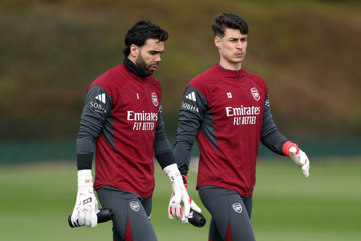 David Raya and Kepa Arrizabalaga of Arsenal walk onto the pitch during the Arsenal FC Training Session ahead of the UEFA Champions League 2025/26 Round of 16 Second Leg match at Sobha Realty Training Centre on March 16, 2026 in London Colney, England.