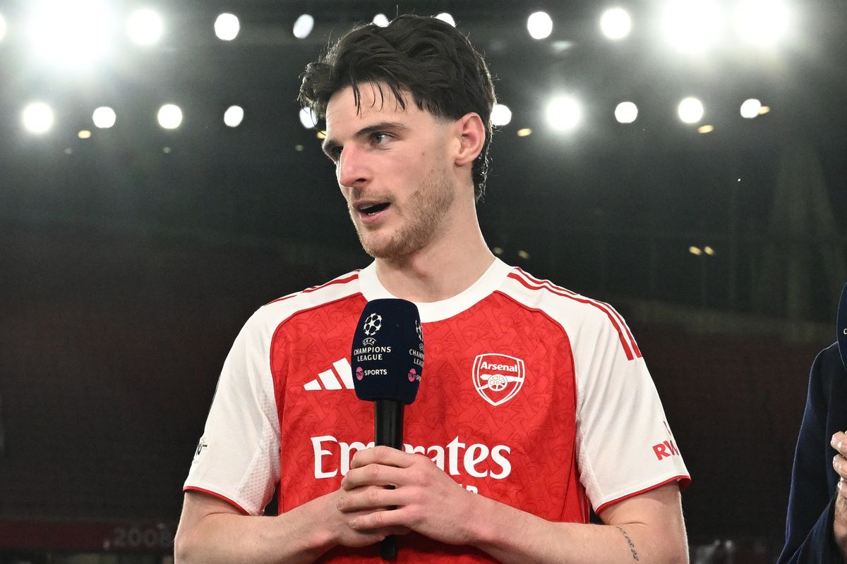Declan Rice of Arsenal is interviewed by Laura Woods, Karen carney and Martin Keown after the UEFA Champions League 2025/26 Round of 16 Second Leg match between Arsenal FC and Bayer 04 Leverkusen at Arsenal Stadium on March 17, 2026 in London, England.