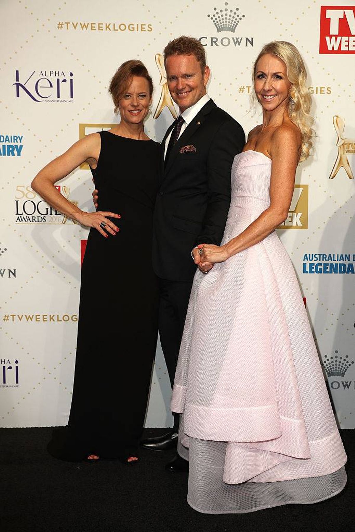 Craig McLachlan poses for a photo with partner Vanessa Scammell (R) and fellow actor Nadine Garner (L) at the 58th Annual Logie Awards at Crown Palladium on May 8, 2016 in Melbourne, Australia