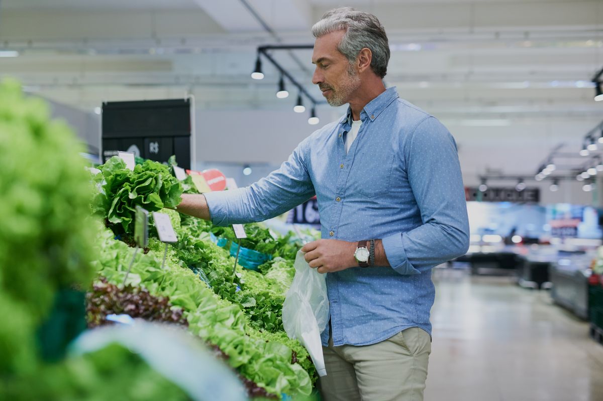 Shot of a handsome mature man shopping for healthy food in a grocery store