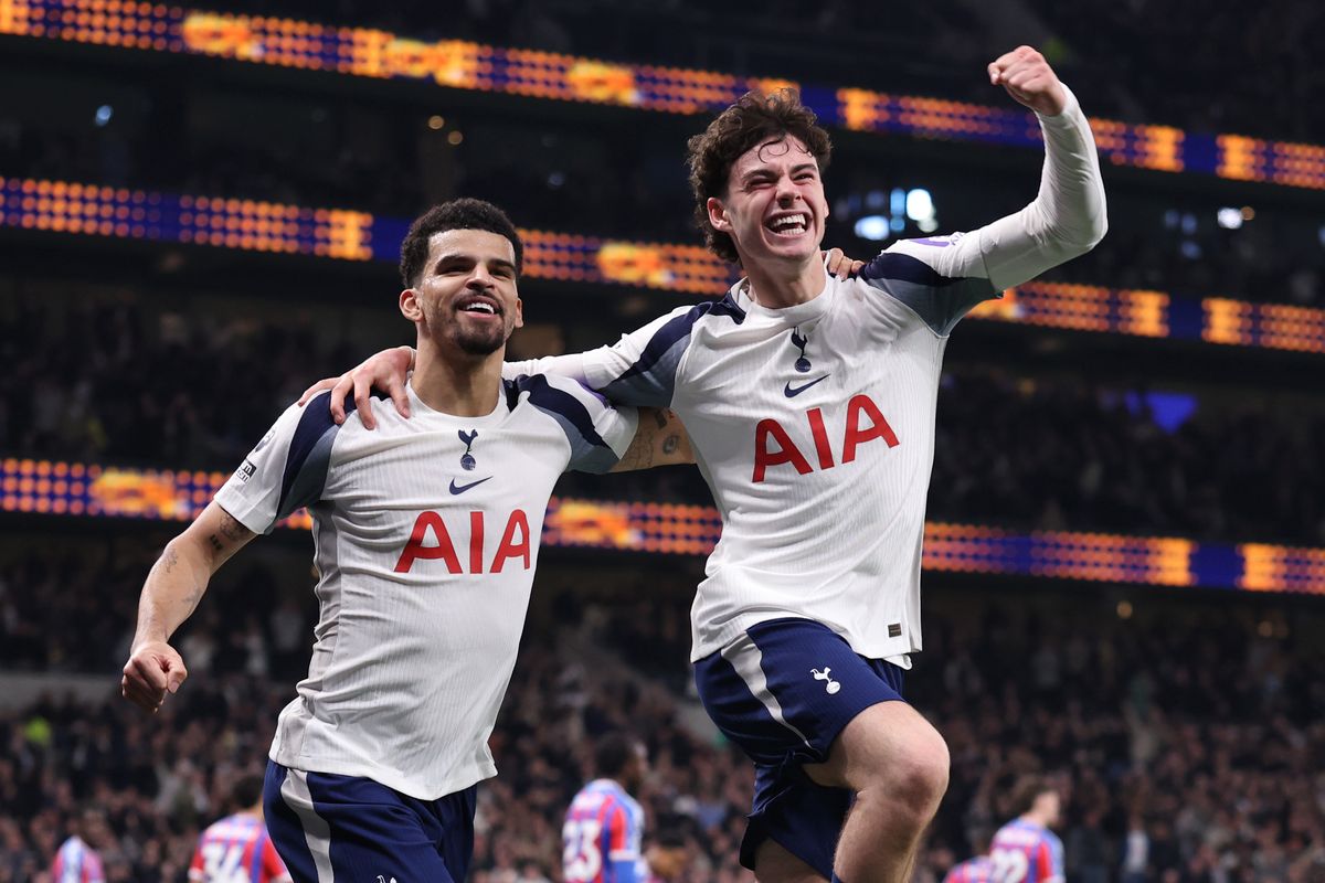 Dominic Solanke of Tottenham Hotspur celebrates after he scores a goal to make it 1-0  with Archie Gray during the Premier League match between Tottenham Hotspur and Crystal Palace