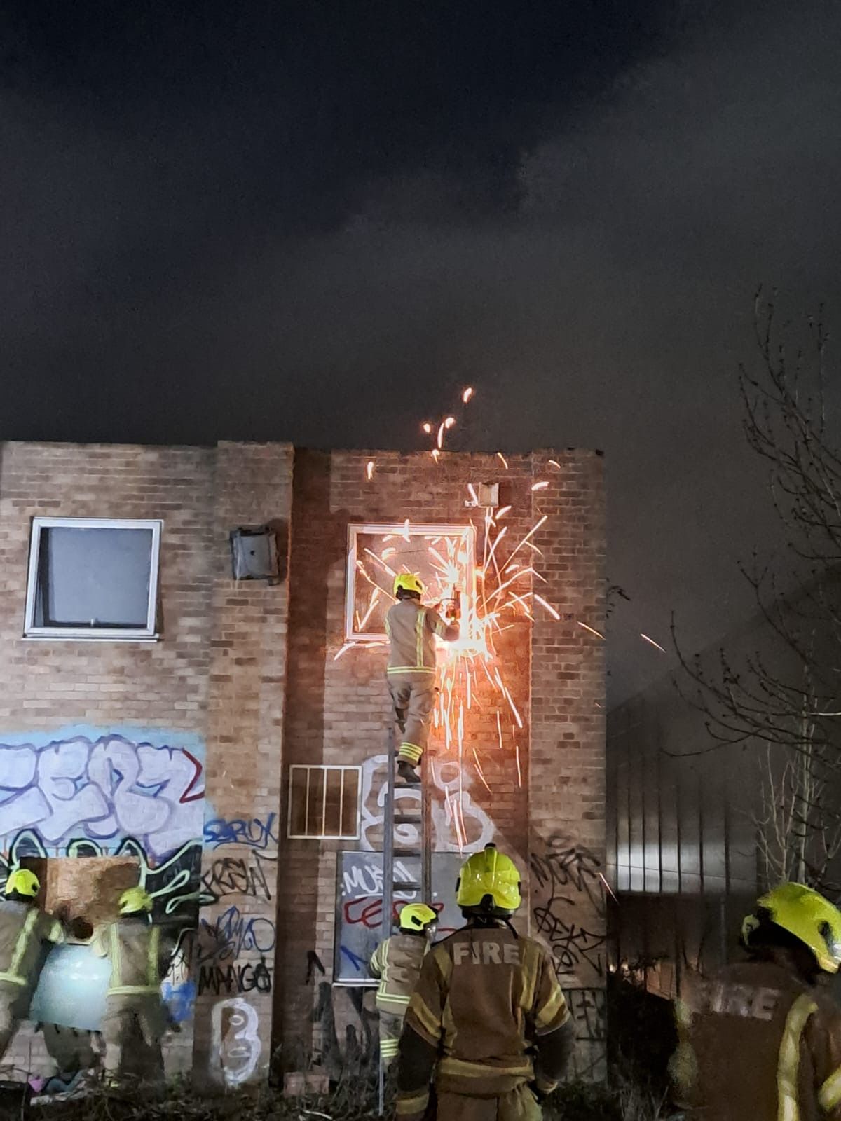 Crews force their way into the property to better access a hotspot 