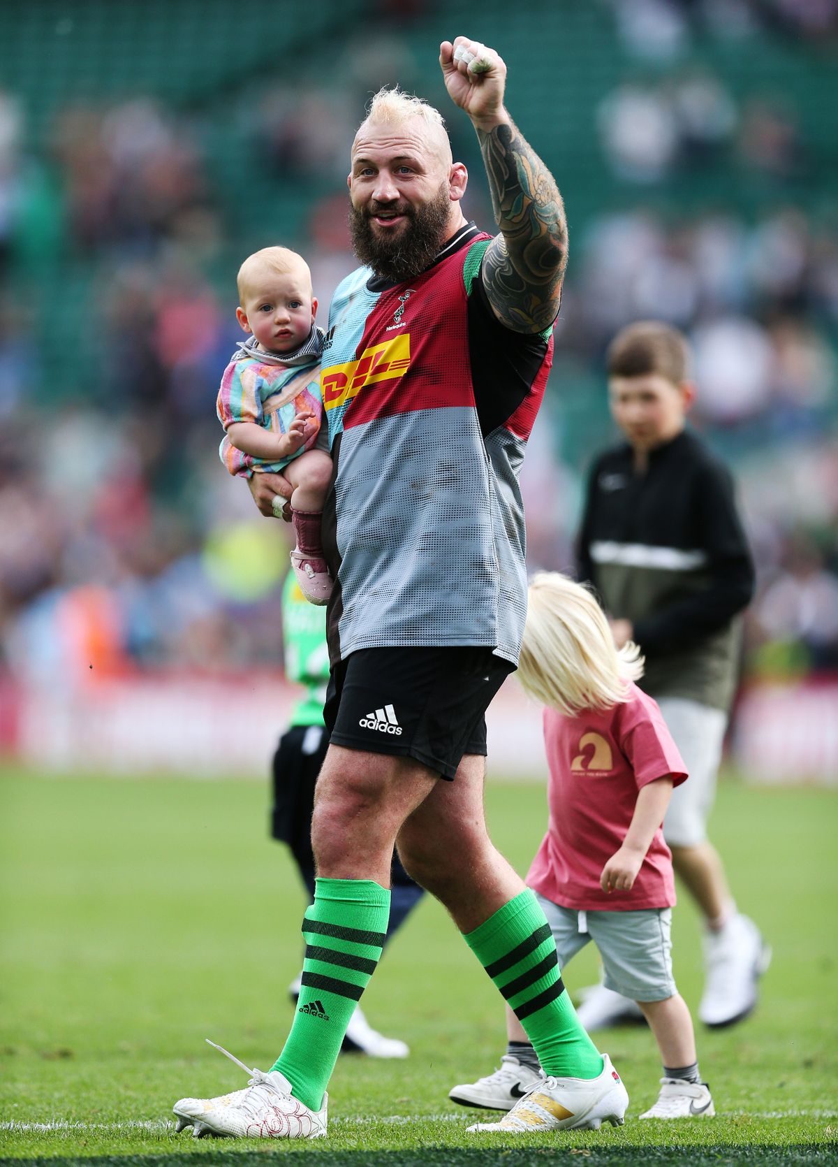 Joe Marler of Harlequins acknowledges the fans with family after their sides victory during the Gallagher Premiership Rugby match between Harlequins and Gloucester Rugby at Twickenham Stoop on May 21, 2022
