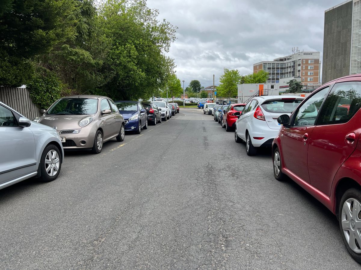 Parking provision has been a consistent problem at the Good Hope Hospital site in Sutton Coldfield - this photo from May 2022 showing two lines of parked cars either side of a narrowed roadway