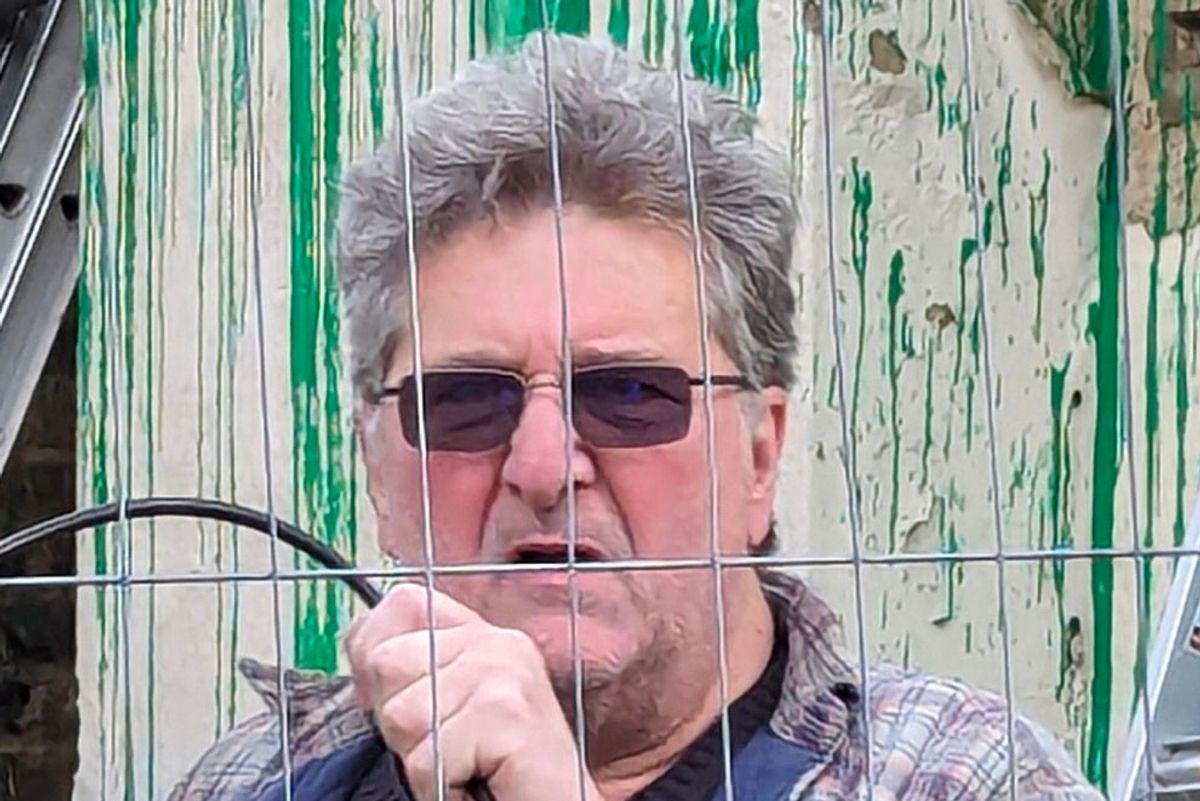 George Georgiou at a Banksy mural