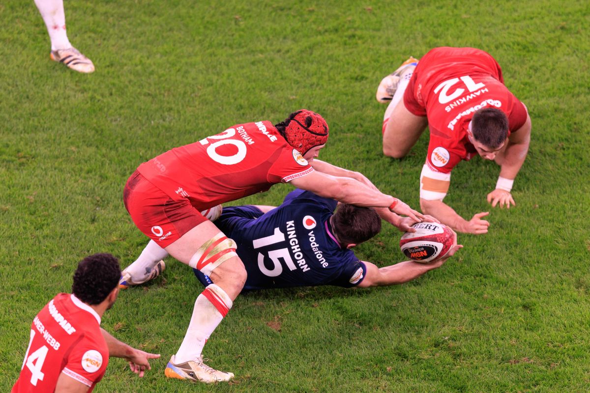 James Botham of Wales wins a turnover