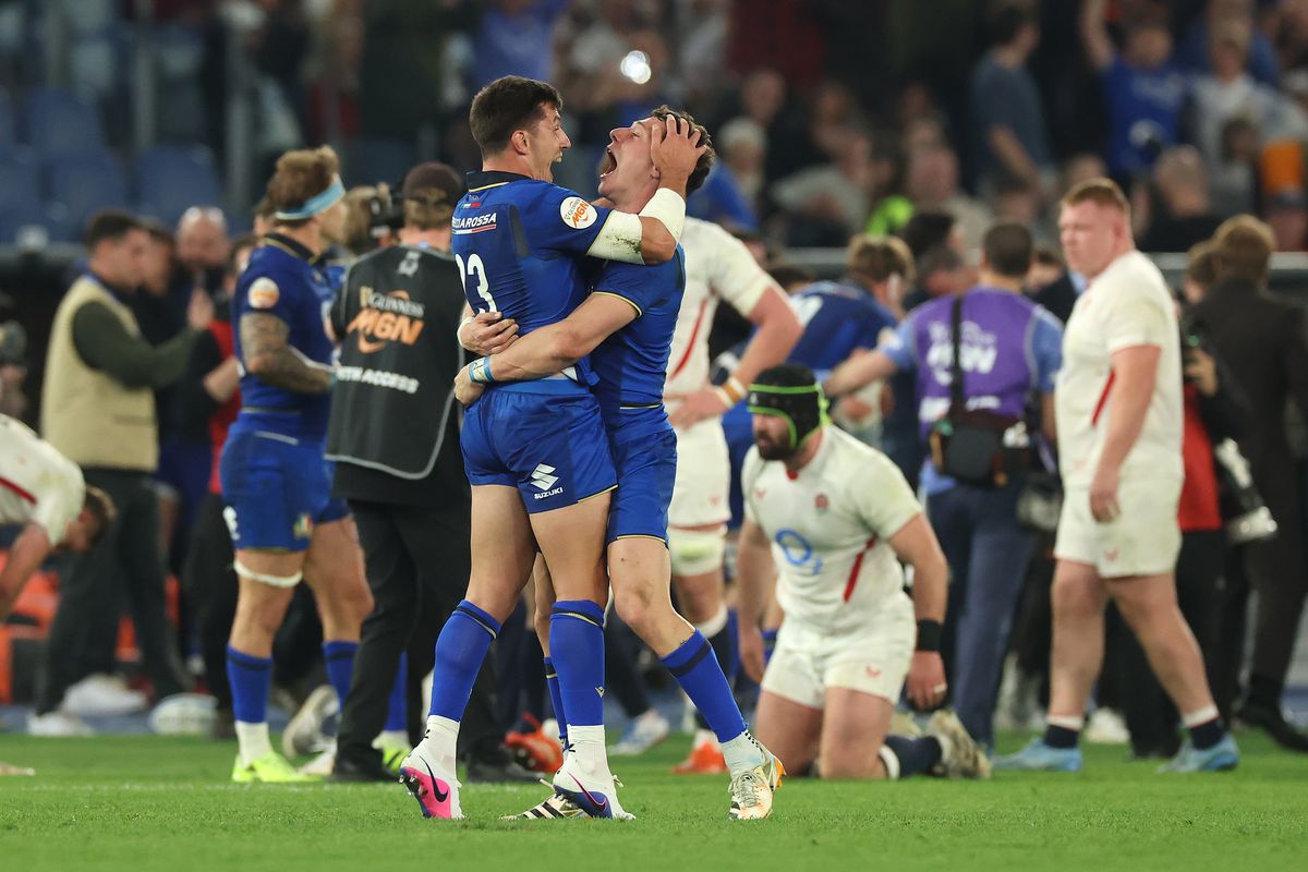 Tommaso Allan (L) and Paolo Garbisi of Italy celebrate victory over England