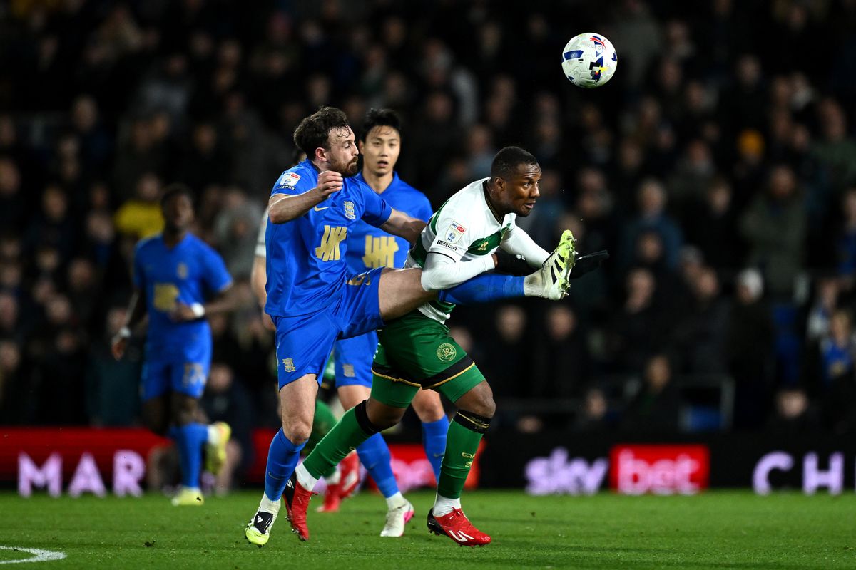 Birmingham City defender Jack Robinson challenges QPR forward Richard Kone