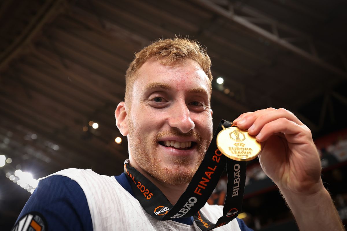 Dejan Kulusevski of Tottenham Hotspur FC poses with his Winners' medal following the 1-0 victory in the UEFA Europa League Final 2025 between Tottenham Hotspur and Manchester United