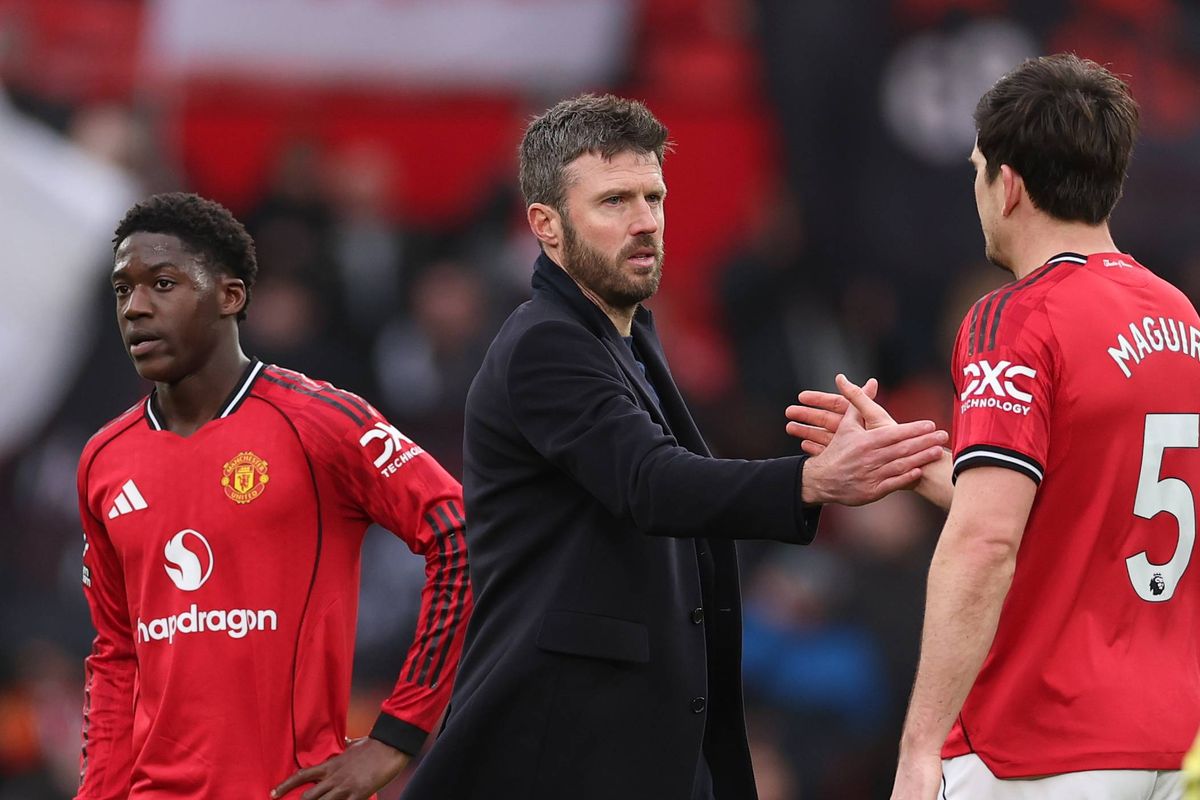 MANCHESTER, ENGLAND - MARCH 15: Michael Carrick Head Coach of Manchester United shakes hands with Harry Maguire after the Premier League match between Manchester United and Aston Villa at Old Trafford on March 15, 2026 in Manchester, England. (Photo by Stu Forster/Getty Images)