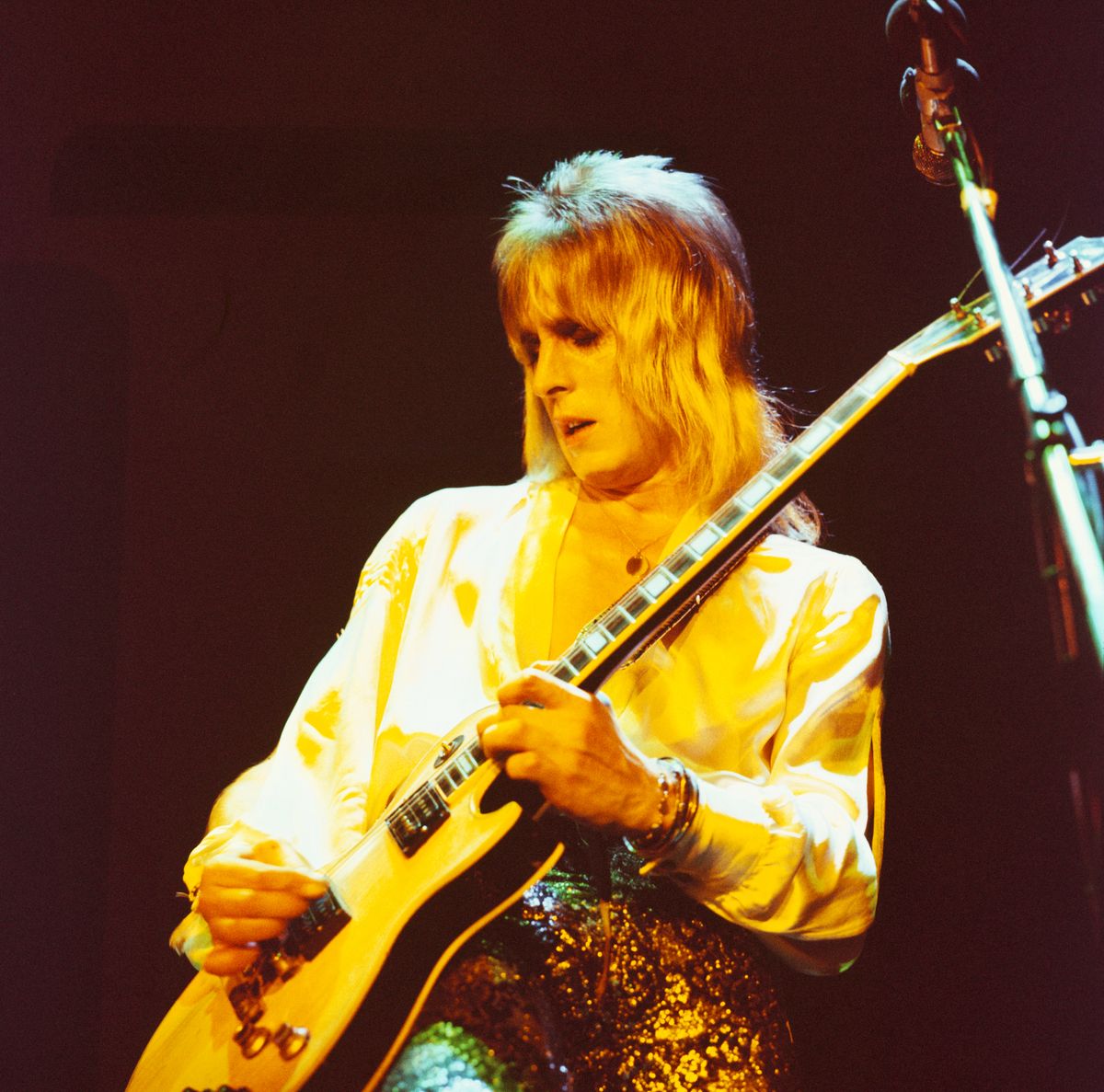 Mick Ronson performs on stage with David Bowie and the Spiders from Mars during the final night of the Ziggy Stardust tour at the Hammersmith Odeon in London on July 3, 1973