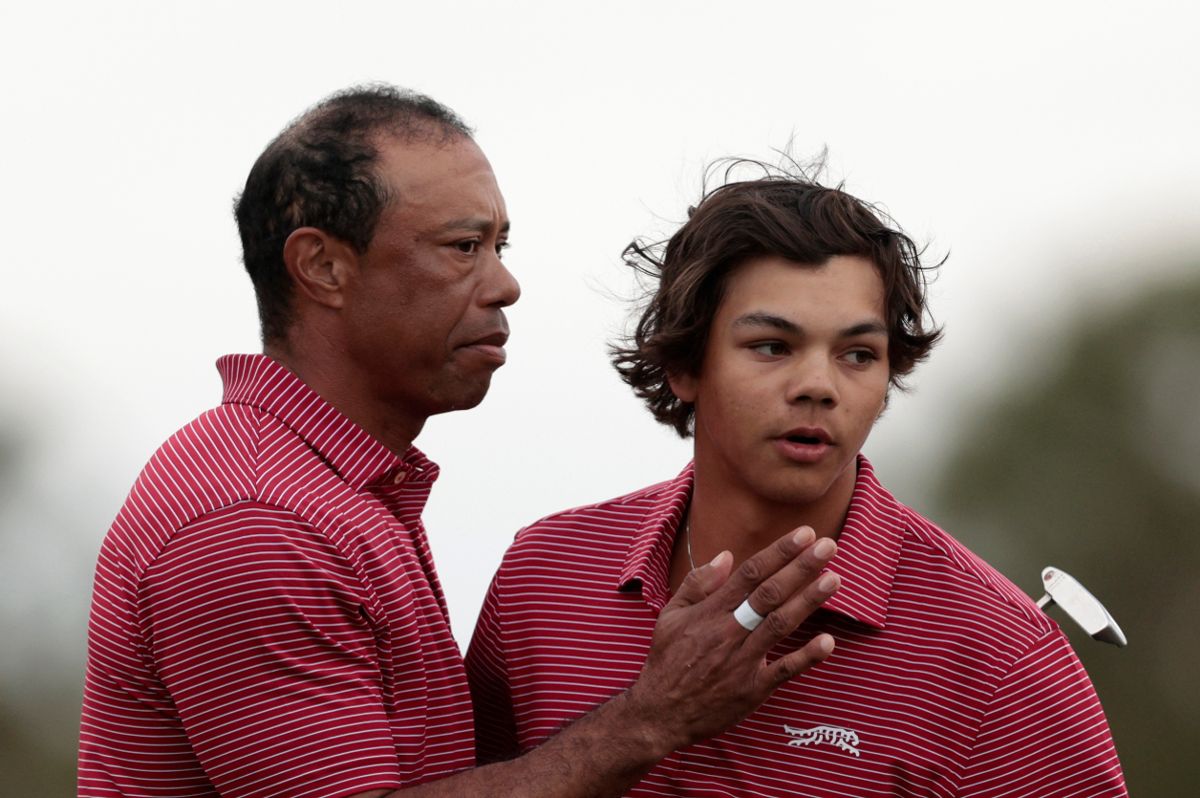 Tiger Woods embraces his son, Charlie