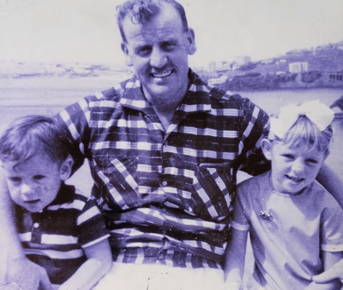 Pat as a child with her brother and father