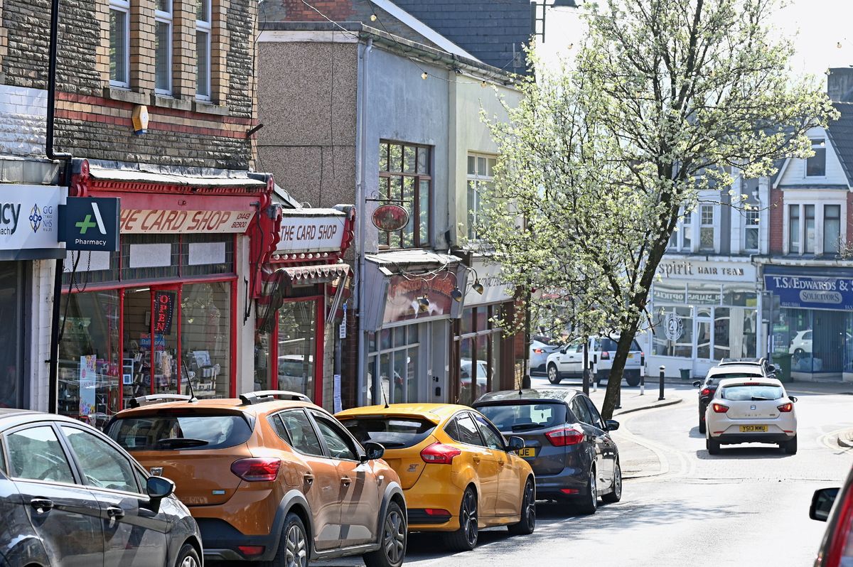The image shows the busy high street on a sunny Saturday afternoon in March