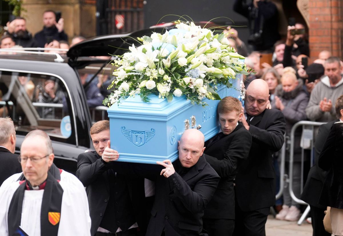 Ricky Hatton's brother Matthew and son Campbell carrying the coffin of the boxing legend into the cathedral