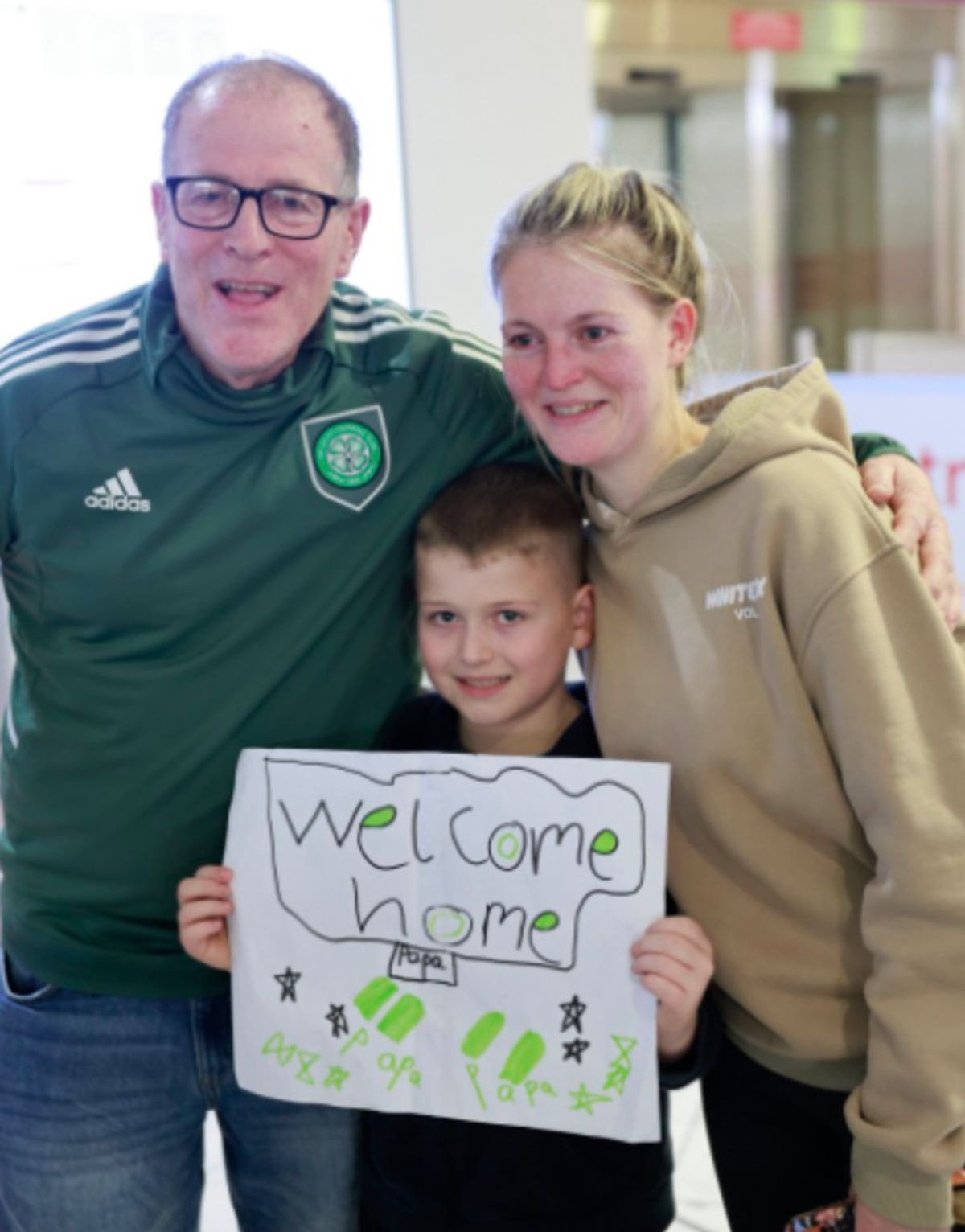 Kevin McLean, daughter Ashleigh and grandson Hayden at the airport