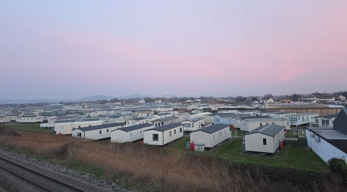 A lot of caravans on a park beside the sea in the coastal resort