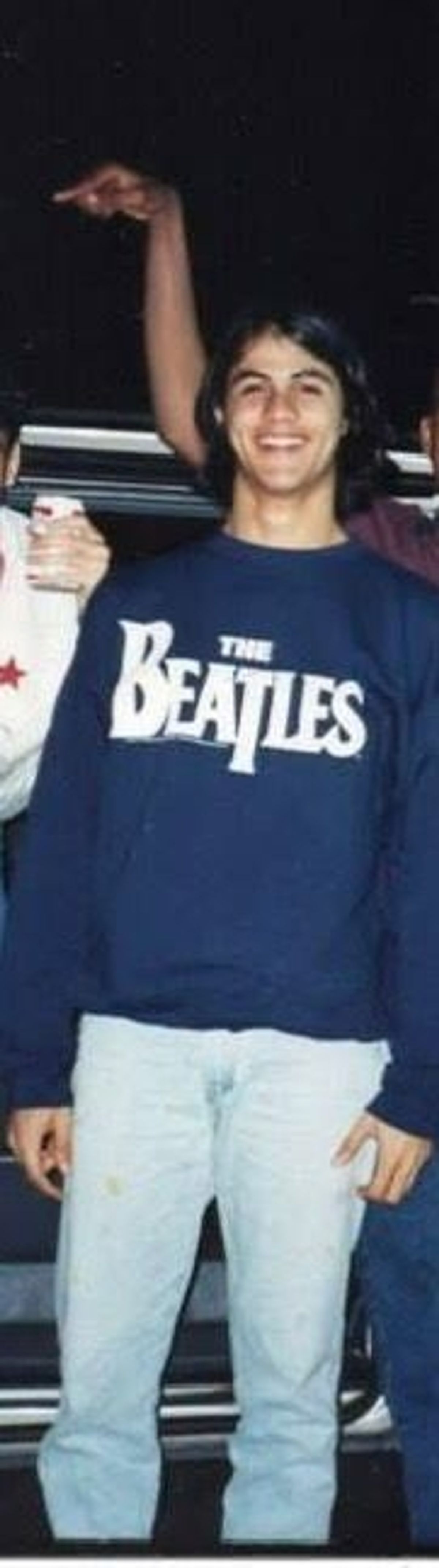 A young Haracio wearing a The Beatles jumper.