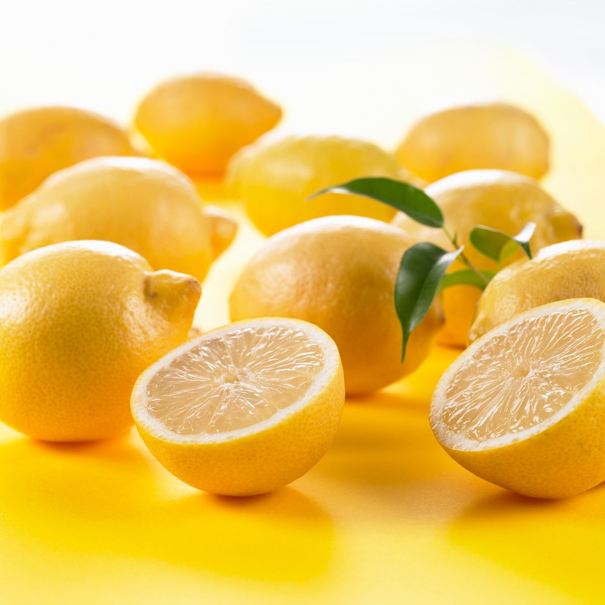 Whole lemons and one halved lemon