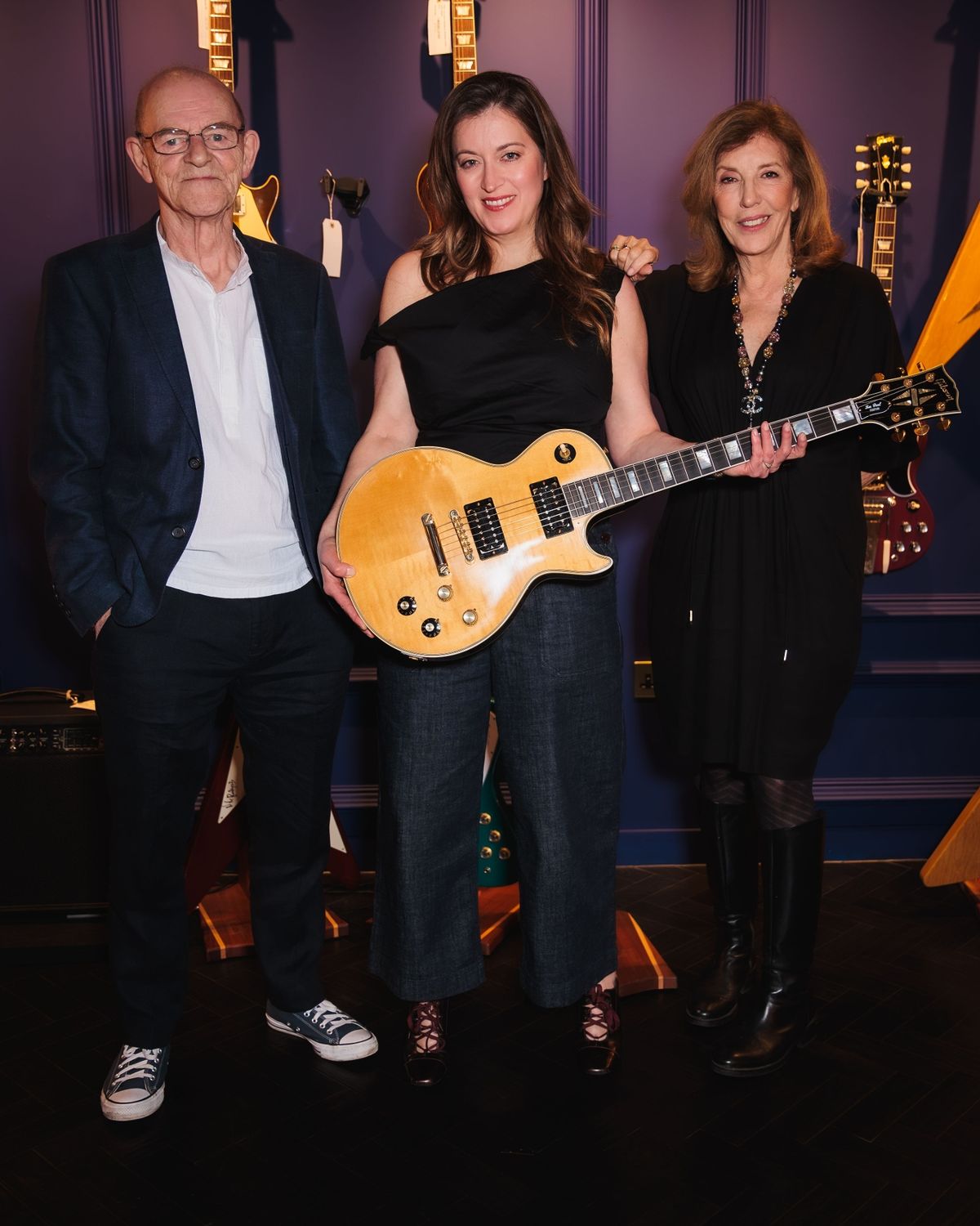 Woody Woodmansey, Lisa Ronson and Suzi Ronson at Gibson Guitars' launch of a limited-edition replica of the 1968 Les Paul Custom, the iconic guitar of the late, great Mick Ronson