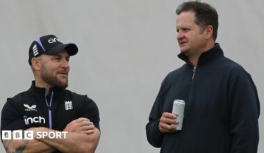 Brendon McCullum left, talks to Rob Key who is holding a drink