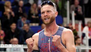 Josh Kerr celebrates winning world indoor 3,000m gold