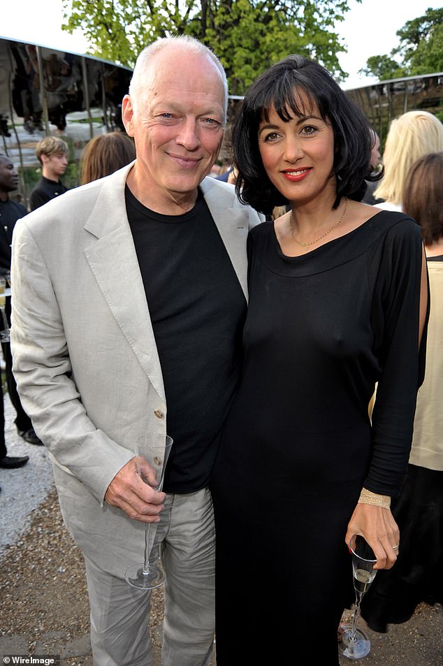 The couple insisted they had ¿fallen in love¿ with their new home and said they were looking forward to hosting some ¿memorable parties¿ there (pictured at the annual summer party at The Serpentine Gallery in London on July 9, 2009)