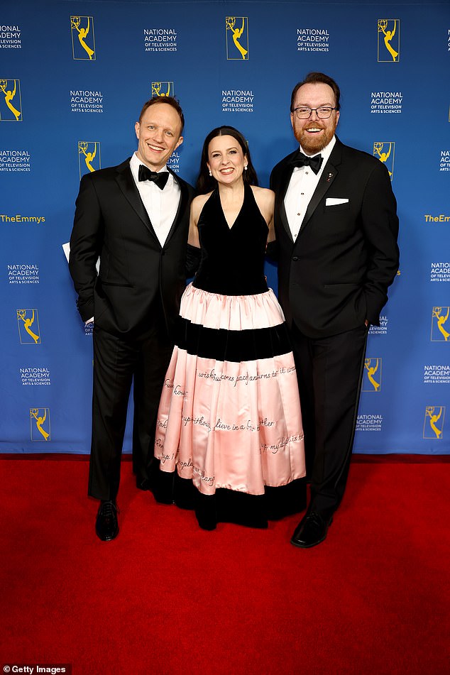 The couple posed on the red carpet with Adam Sharp, The National Academy of Television Arts and Sciences CEO and president