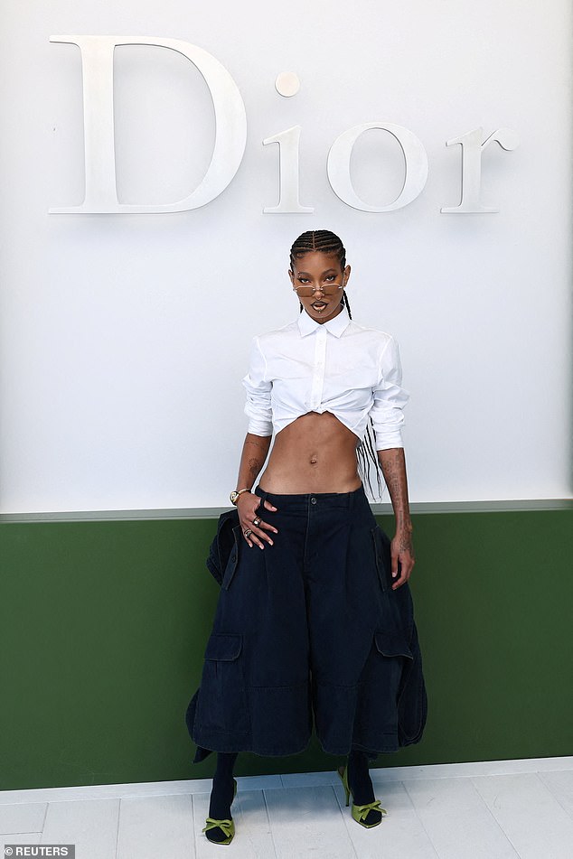 The daughter of Will Smith and Jada Pinkett Smith, 25, was wearing a pair of green heels with bow details, as well as a pair of oval shades