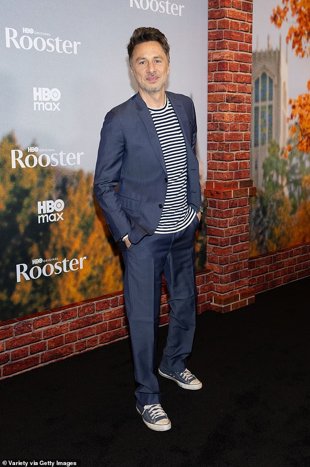 Scrubs star Zach Braff blended casual and dress styles, with a lustrous dark blue suit contrasted with a blue-and-white striped shirt and weathered sneakers
