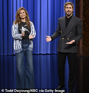 Mendes was stylish in a pair of loose-fitting jeans as well as a printed black shirt and blue-striped cardigan