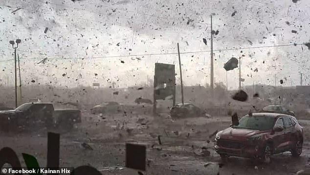 The storm in western Oklahoma lifted debris and dirt into the air. Tornado warnings were issued in surrounding states