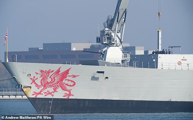 Type 45 air defence destroyer HMS Dragon (pictured loading with missiles) will not be ready to set sail for the Eastern Mediterranean from Portsmouth until next week